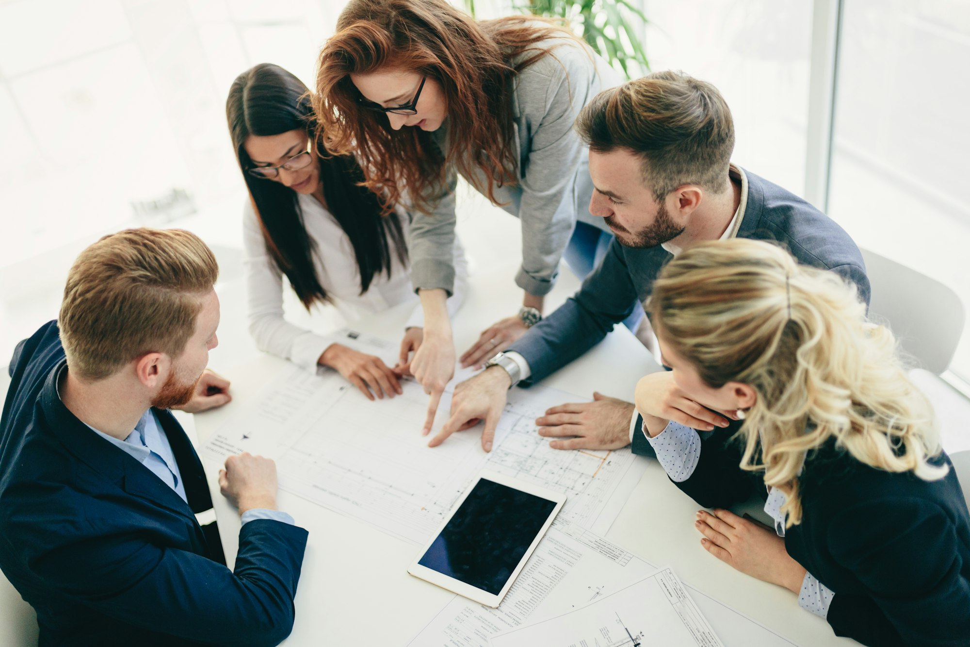 Collaboration and analysis by business people working in office