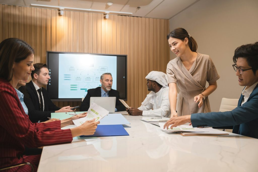 group of businesspeople sitting together in a meeting for best ideas, International executive team